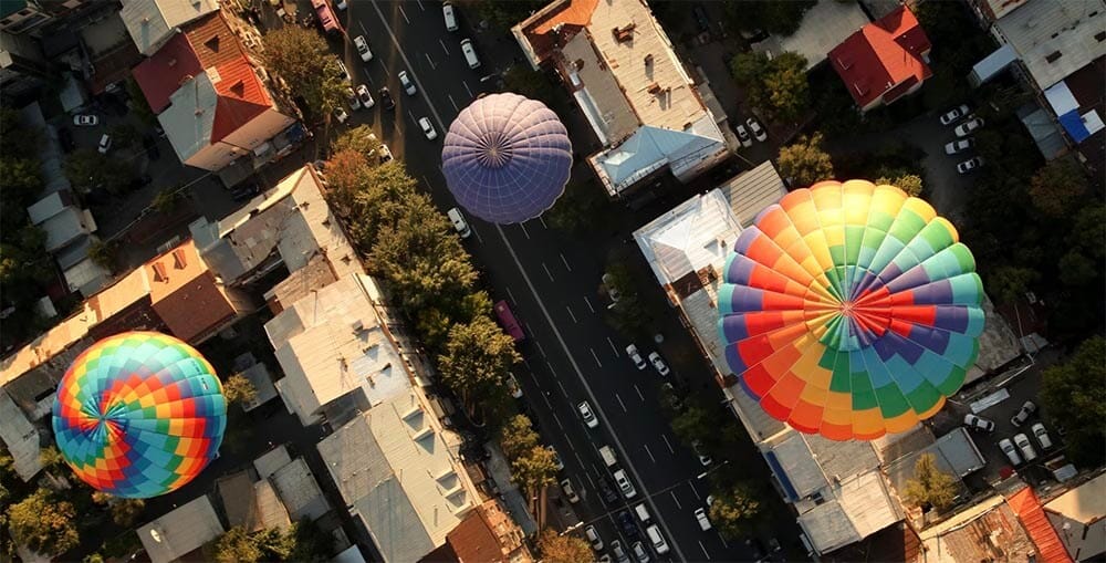 A high-angle camera shot is a type of camera angle where the camera is positioned above the subject, looking down at them. 