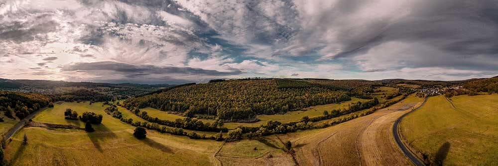 panoramic-shot-farm-fields-sunlight-cloudy-sky-countryside