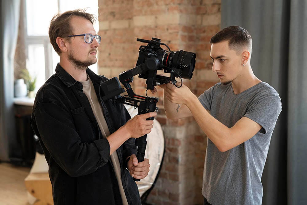 man-filming-with-professional-camera